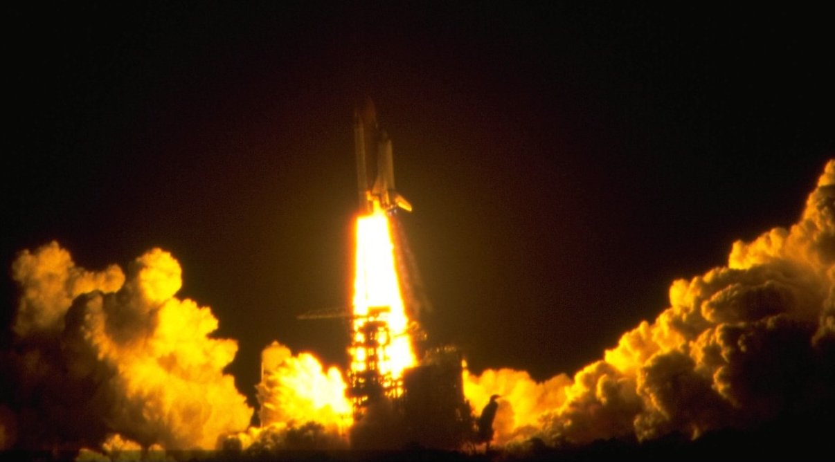 Space shuttle night launch seen from the VIP viewing site.
