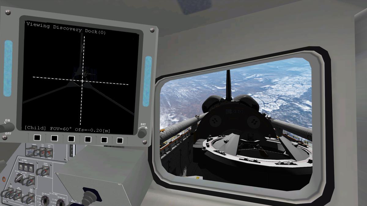STS-121
View of Atlantis Payload Bay as she arrives below the ISS on FD3. The dispaly on the A1 Panel shows the docking camera pointing at the Station